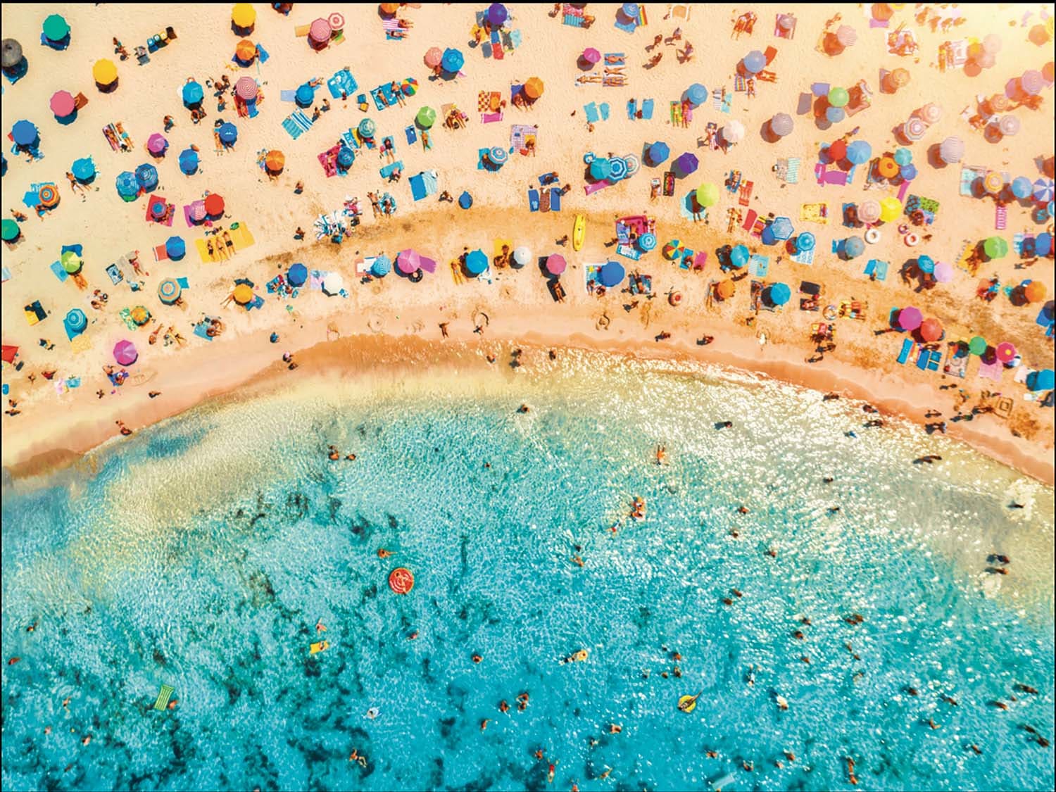 Aerial View of Sandy Beach with Colorful Umbrellas People